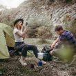 Couple camping at a campsite in the mountains.