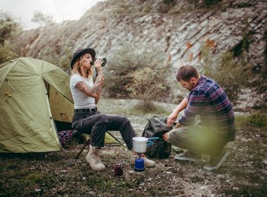 Couple camping at a campsite in the mountains.
