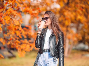Woman drinking coffee during the Fall.