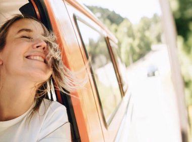 Woman on a roadtrip in a skoolie.