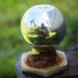 Close up of a weather hitch ball reflecting camera man in metal.