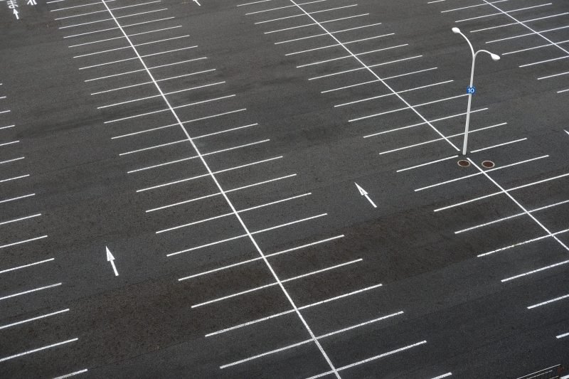 An empty warehouse parking lot common with the supply chain backlog currently being experienced.