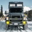 EarthRoamer XV in mountainous terrain traversing through the snow.