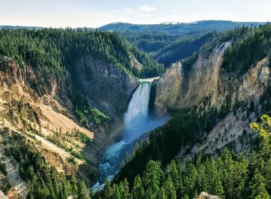 View over the landscape in Yellowstone National Park of a waterfall.