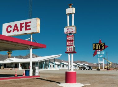 A California gas station and cafe lists gas prices at 4.999 and above.