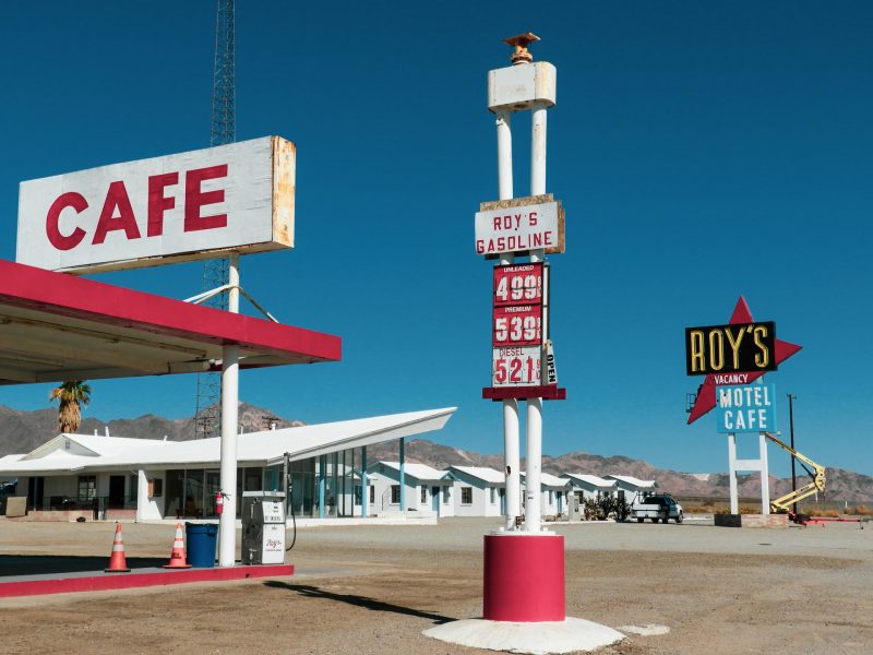 A California gas station and cafe lists gas prices at 4.999 and above.