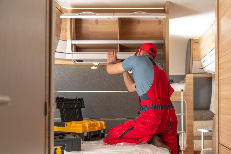 A serviceman builds a new RV interior