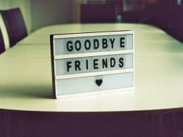 A sign that says goodbye friends with a heart shape.