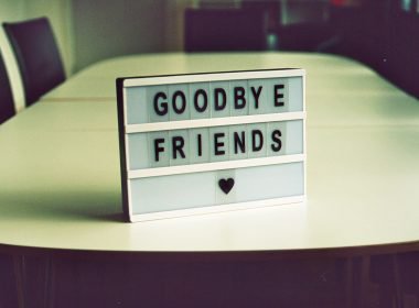A sign that says goodbye friends with a heart shape.