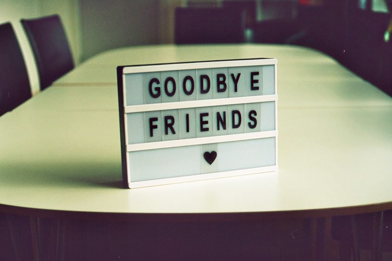 A sign that says goodbye friends with a heart shape.