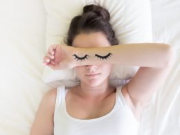 Painted sleeping eye of Cute young woman in the bed