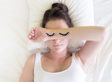 Painted sleeping eye of Cute young woman in the bed