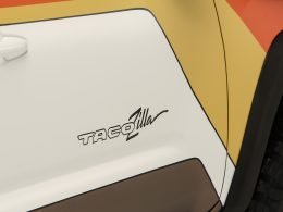 Close up of the name Tacozilla printed on the sign of the overlanding truck.