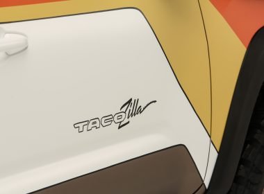 Close up of the name Tacozilla printed on the sign of the overlanding truck.