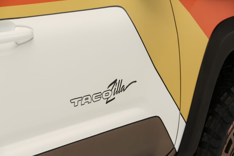 Close up of the name Tacozilla printed on the sign of the overlanding truck.