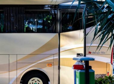 A luxury class A motorhome parked outside at a resort.