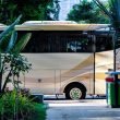 A luxury class A motorhome parked outside at a resort.