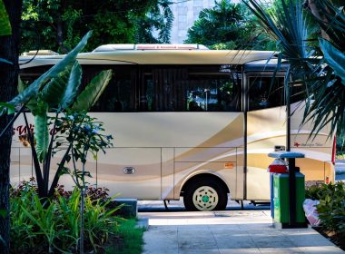 A luxury class A motorhome parked outside at a resort.