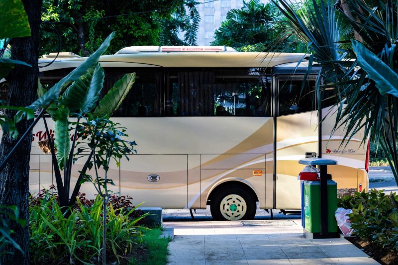 A luxury class A motorhome parked outside at a resort.