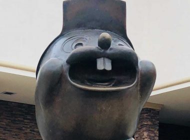 A closeup of Buc-ee the Beaver's face as a statue outside the travel center.