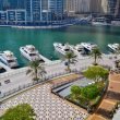A luxury marina in Dubai, with docks lining the city streets in a canal.