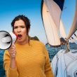 A woman shouting into a megaphone and a sailboat in the background.