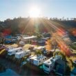 Aerial view of a sunny RV park.