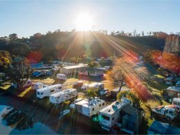 Aerial view of a sunny RV park.