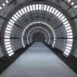 An underground futuristic tunnel with lights.