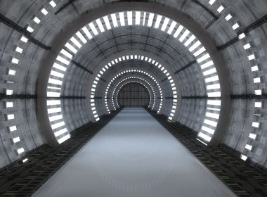 An underground futuristic tunnel with lights.