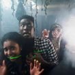 Friends being followed by a monster in a haunted house.