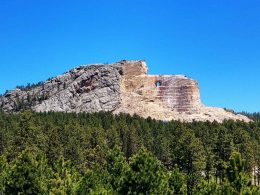 A portrait view of the partially completed Crazy Horse Memorial statue in the Black Hills.