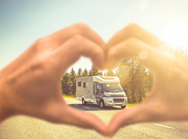 Hands making heart around RV