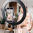 Woman influencer using ring light