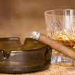 Cigarette ashtray and vintage whiskey