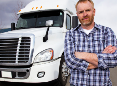 Truck driver in front of semi-truck