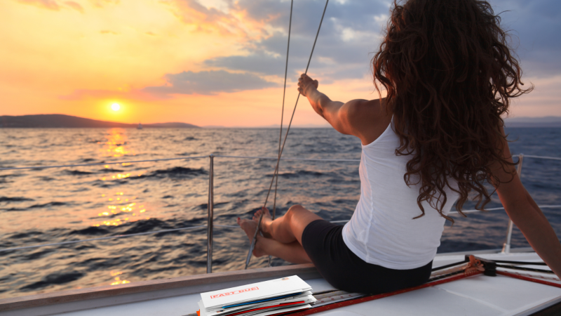 Woman sailing with pile of mail