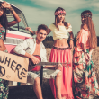 Rainbow Children by old camper van