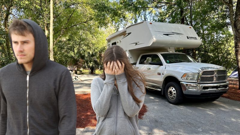 A couple fighting while standing outside of their RV.