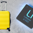 Yellow suitcase alongside a lithium battery.