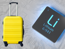 Yellow suitcase alongside a lithium battery.