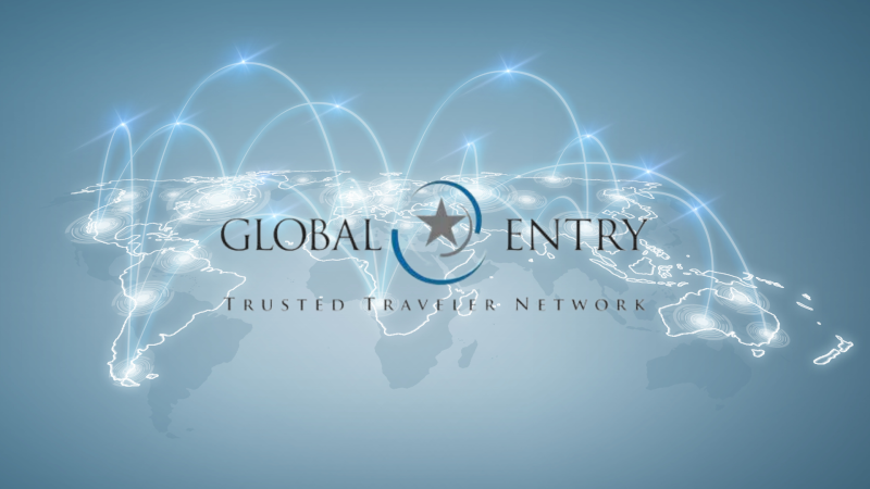 Global entry logo overlaid a global map connected by arches of light.