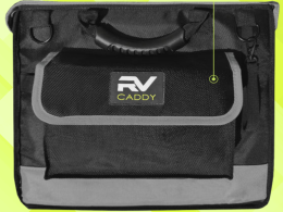 A photo of the RV Caddy by Trailersphere with a yellow background matching the Nomad News colors.