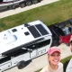 The duo behind Changing lanes in the corner layed over the top of an aerial of their RV trailers and red pick-up truck in two separate driveways.