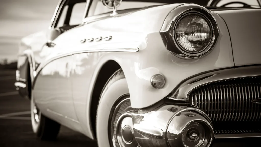 A sepia toned photo of a vehicle from the 1950's.